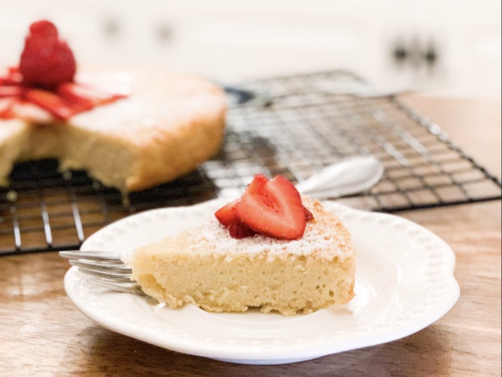 almond cake slice with sliced strawberries