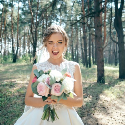 Beautiful bride in fashion wedding dress on natural background