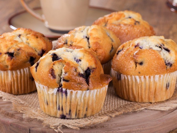 blueberry muffins on a wooden tray