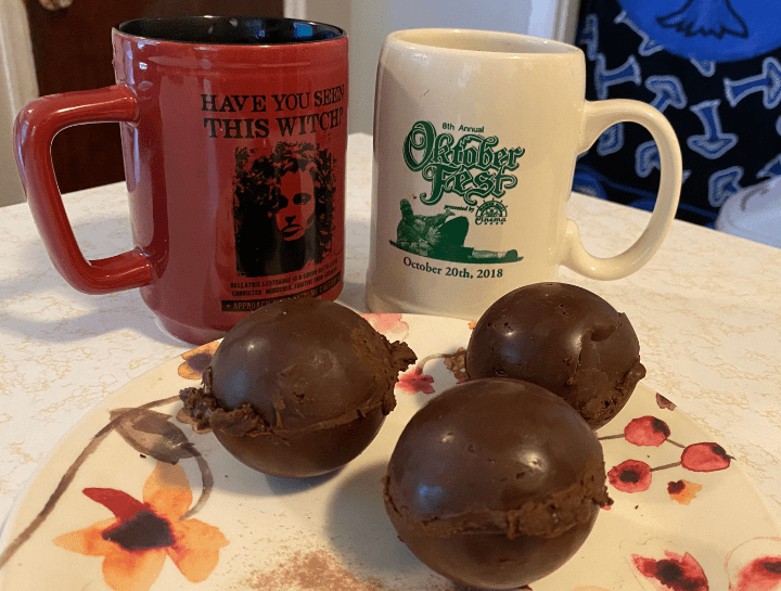 chocolate bombs next to mugs