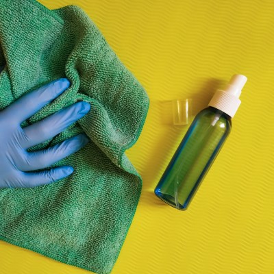 cleaning of yoga mat with disinfectant. disinfect yoga mat