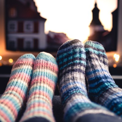 Couple in cozy socks watching movie