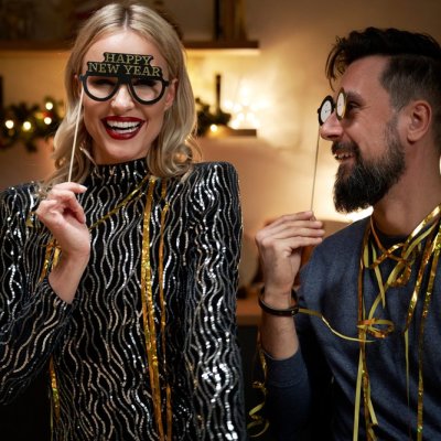 Couple making New Year's Eve photo booths