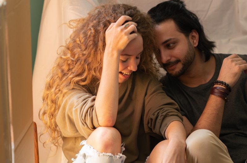 Couple sitting on floor and talking