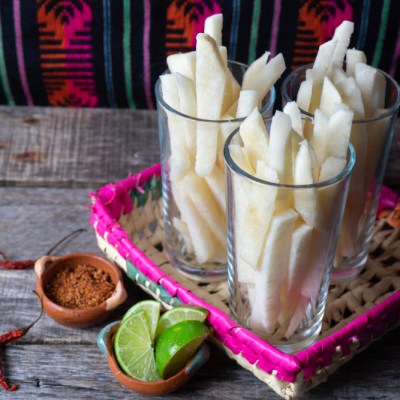 cut jicama in serving dishes with lime and seasoning