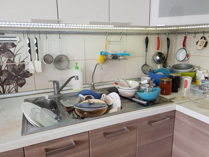 dirty dishes in the sink in the kitchen, lack of water in the water supply and violation of the usual way of life
