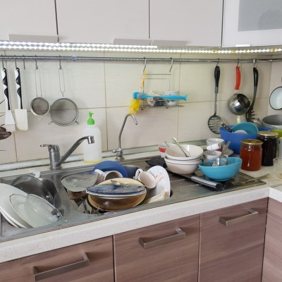 dirty dishes in the sink in the kitchen, lack of water in the water supply and violation of the usual way of life