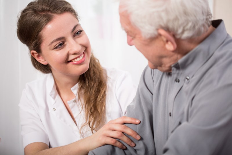 female caregiver with an elderly gentleman