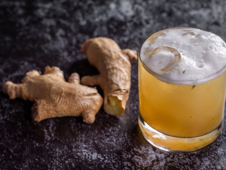 ginger beer with fresh ginger in the background