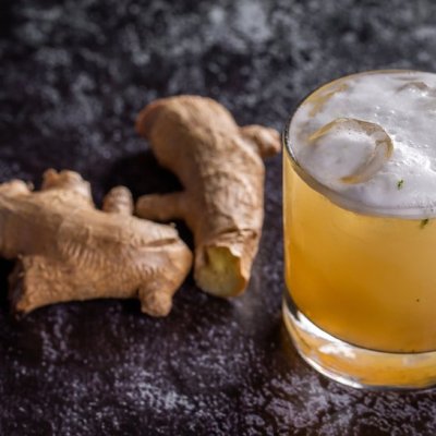 ginger beer with fresh ginger in the background