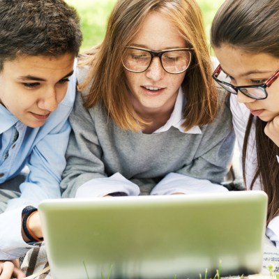 Kids seated around a computer