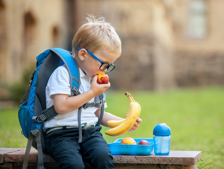 little boy eating lunch