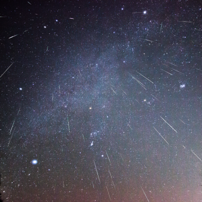 Long exposure shot of meteor shower in starry night sky