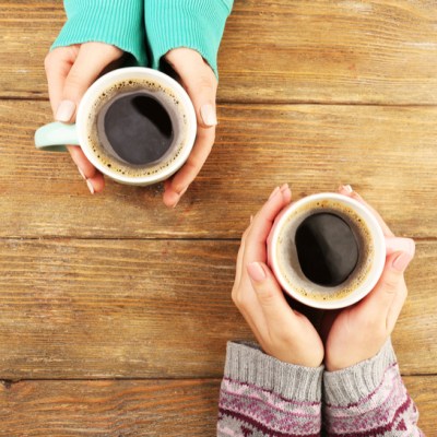 overhead shot of two women drinking coffee