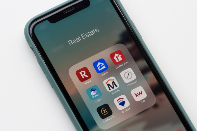 Portland, OR, USA - Feb 2, 2021: Assorted real estate apps are seen on an iPhone, including Redfin, Zillow, Realtor.com, Trulia, Movoto, Compass, Century 21, REMAX, and KW.