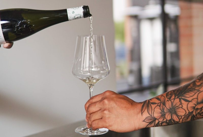 pouring glass of white wine