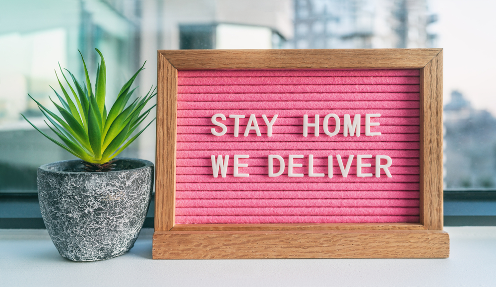 sign that reads "stay home we deliver"