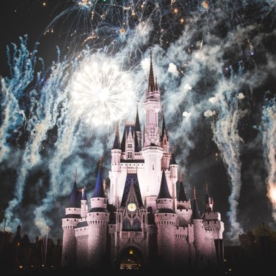The Magic Kingdom surrounded by fireworks at night