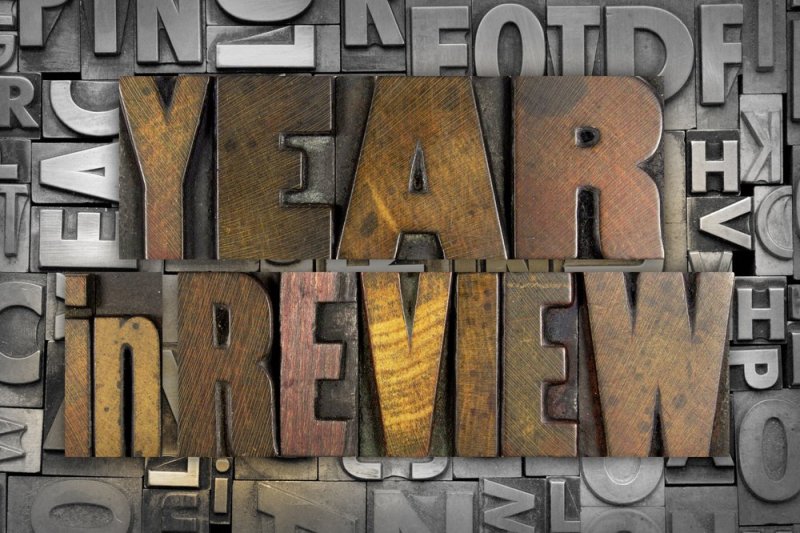 The words YEAR IN REVIEW written in vintage letterpress type