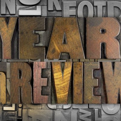 The words YEAR IN REVIEW written in vintage letterpress type