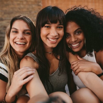 three girlfriends taking a selfie