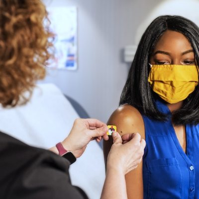 woman getting a vaccine