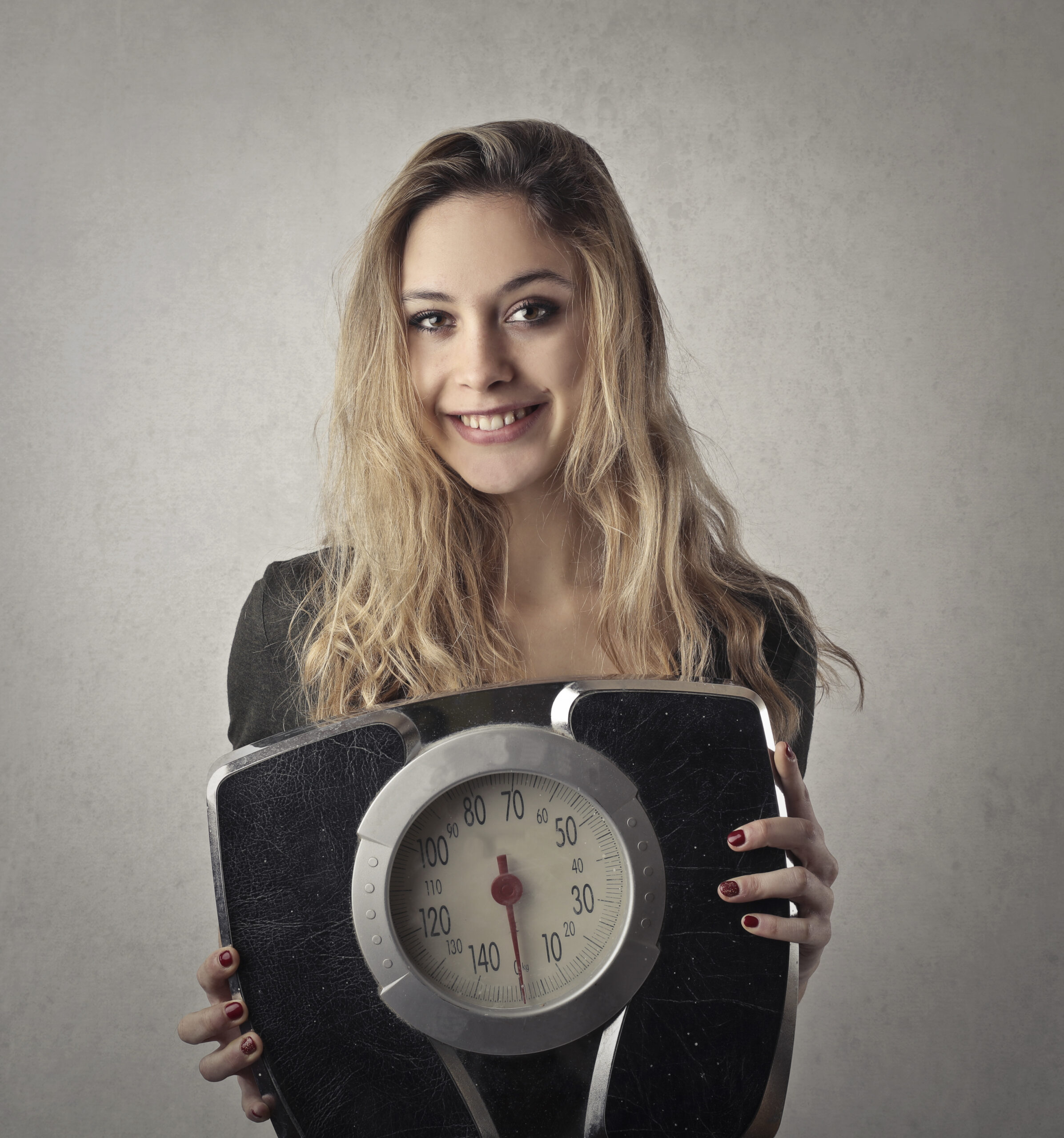 woman holding scale