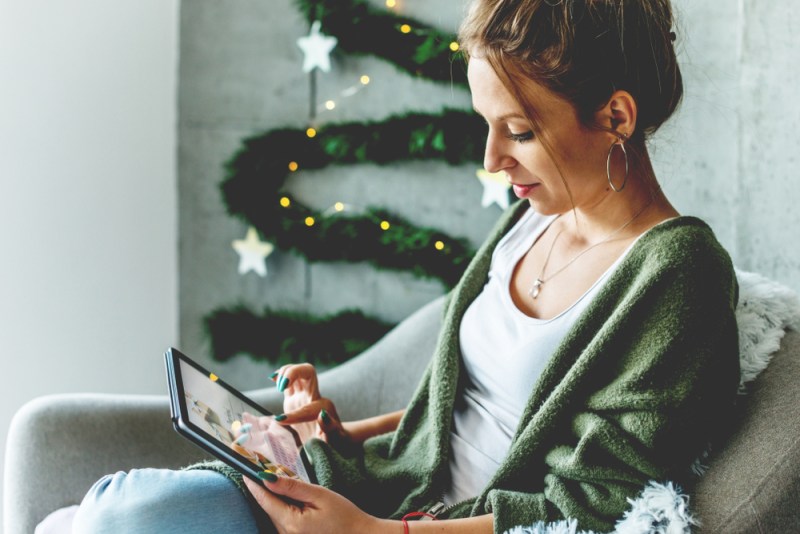 woman holiday shopping on tablet