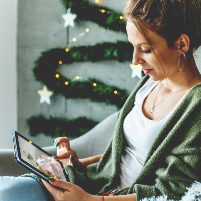 woman holiday shopping on tablet