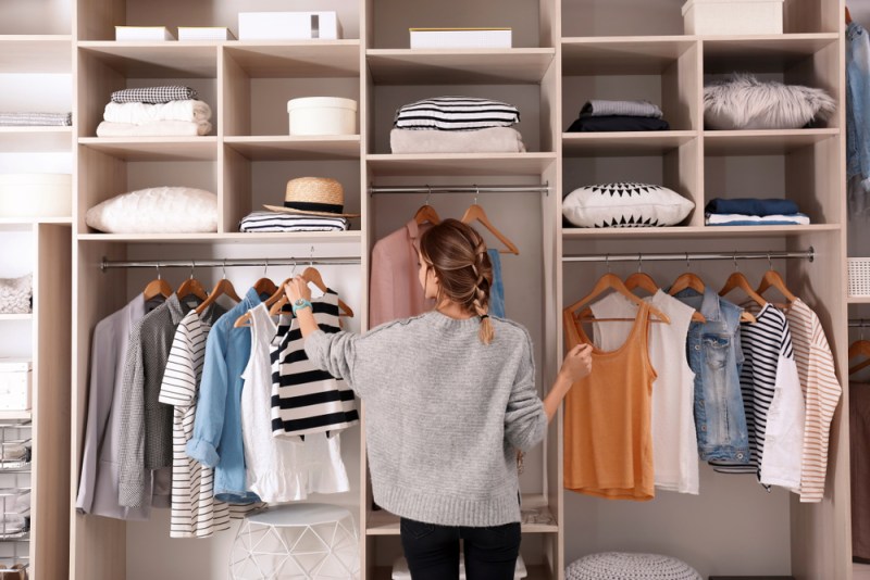 Woman in a neat decluttered closet