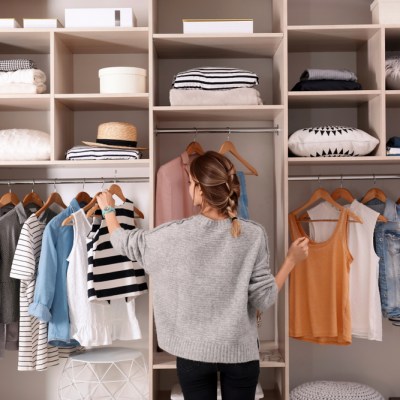 Woman in a neat decluttered closet