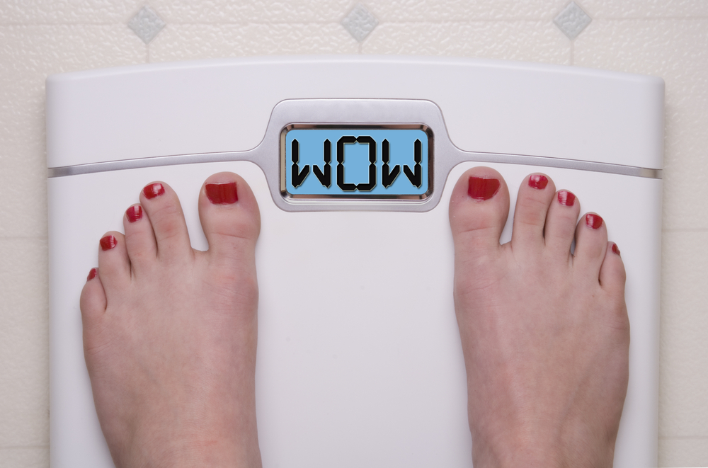 woman on scale scale says WOW