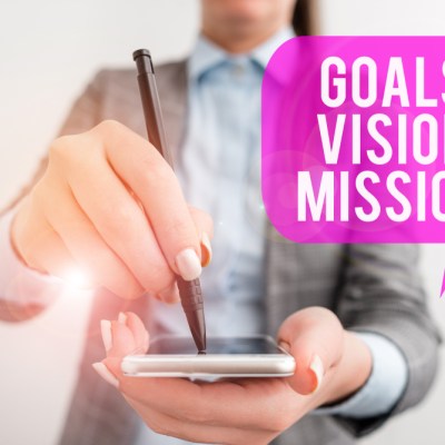 woman with cell phone stating goals, values, mission