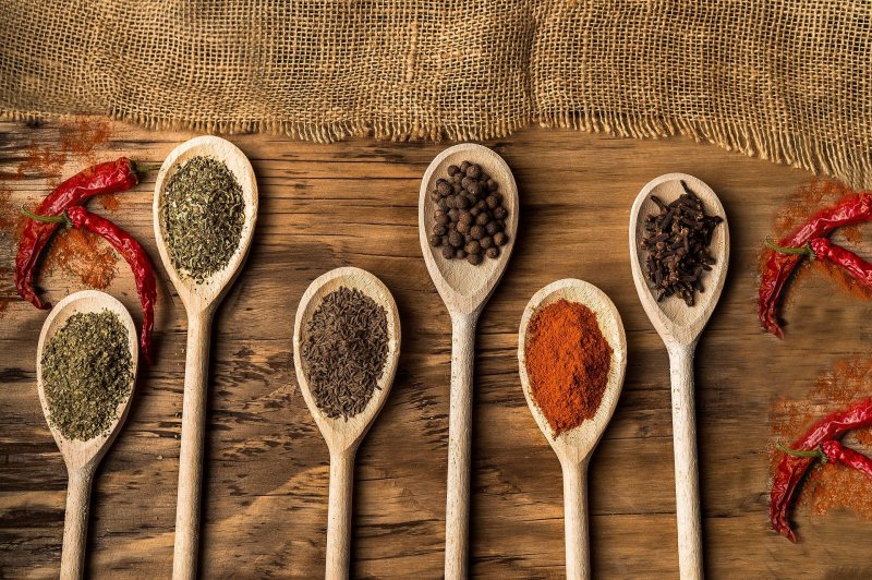 wooden spoons with various spices