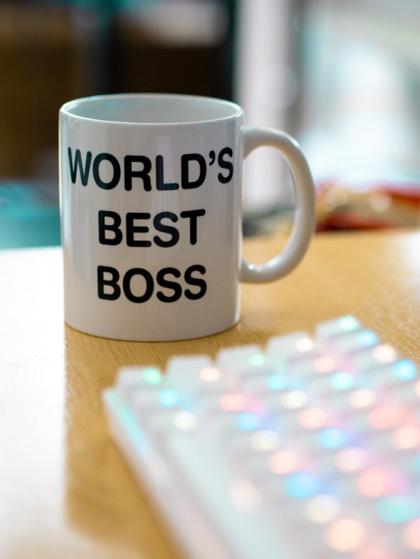 world's best boss mug near to colourful rgb keyboard