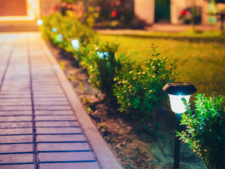 Yard walkway lined with decorative solar powered lights
