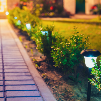 Yard walkway lined with decorative solar powered lights