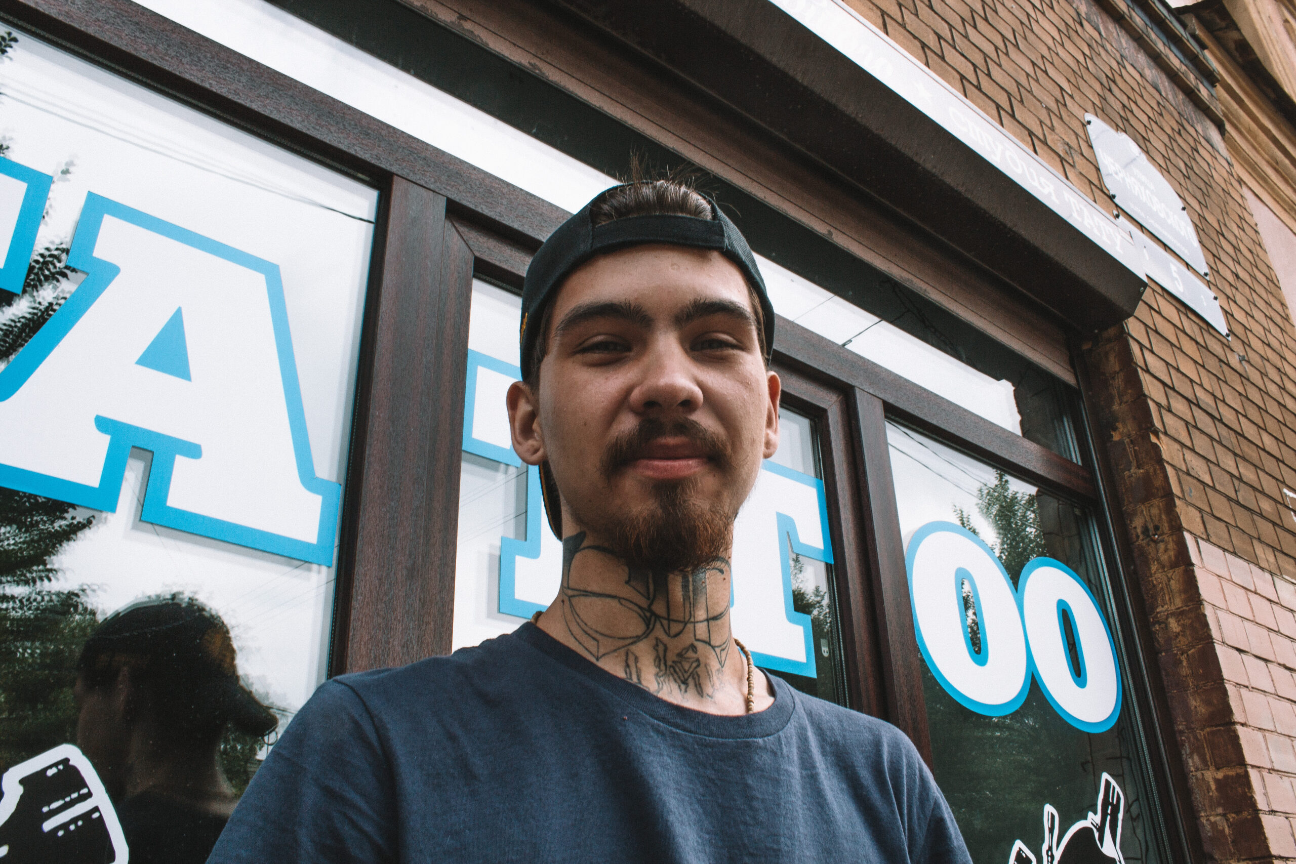 Man with neck tattoo