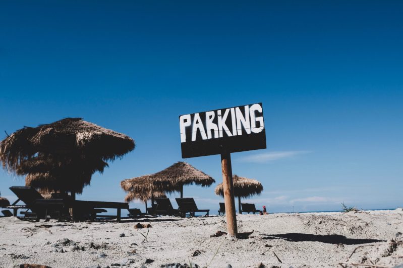 Photo of parking sign on sand