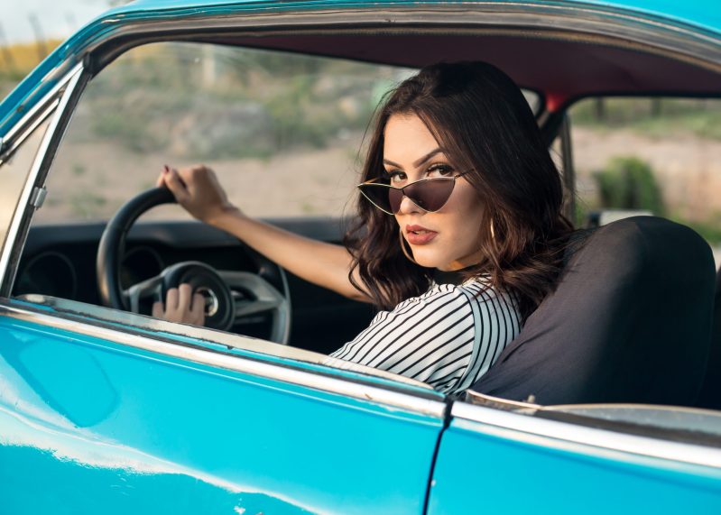 Woman sitting in vehicle