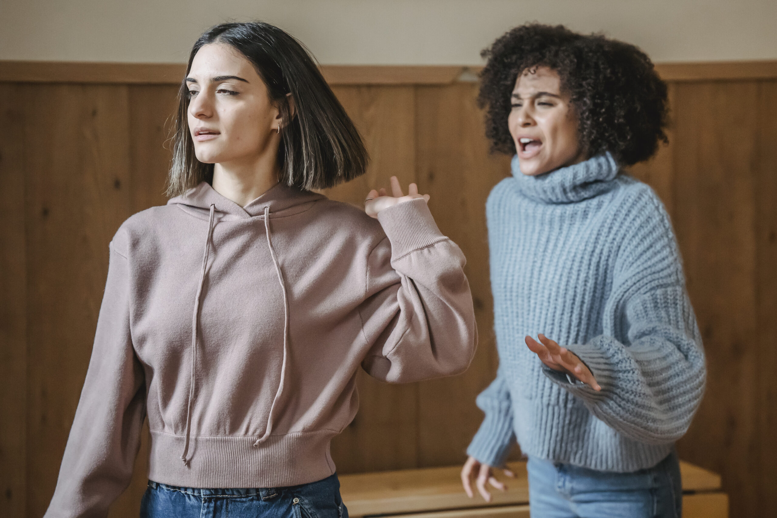 Multiethnic women fighting in room