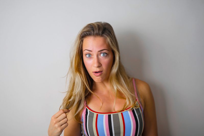 Woman in white blue and red stripe tank top