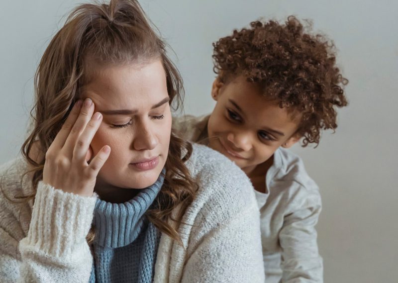 Loving son supporting mother and hugging