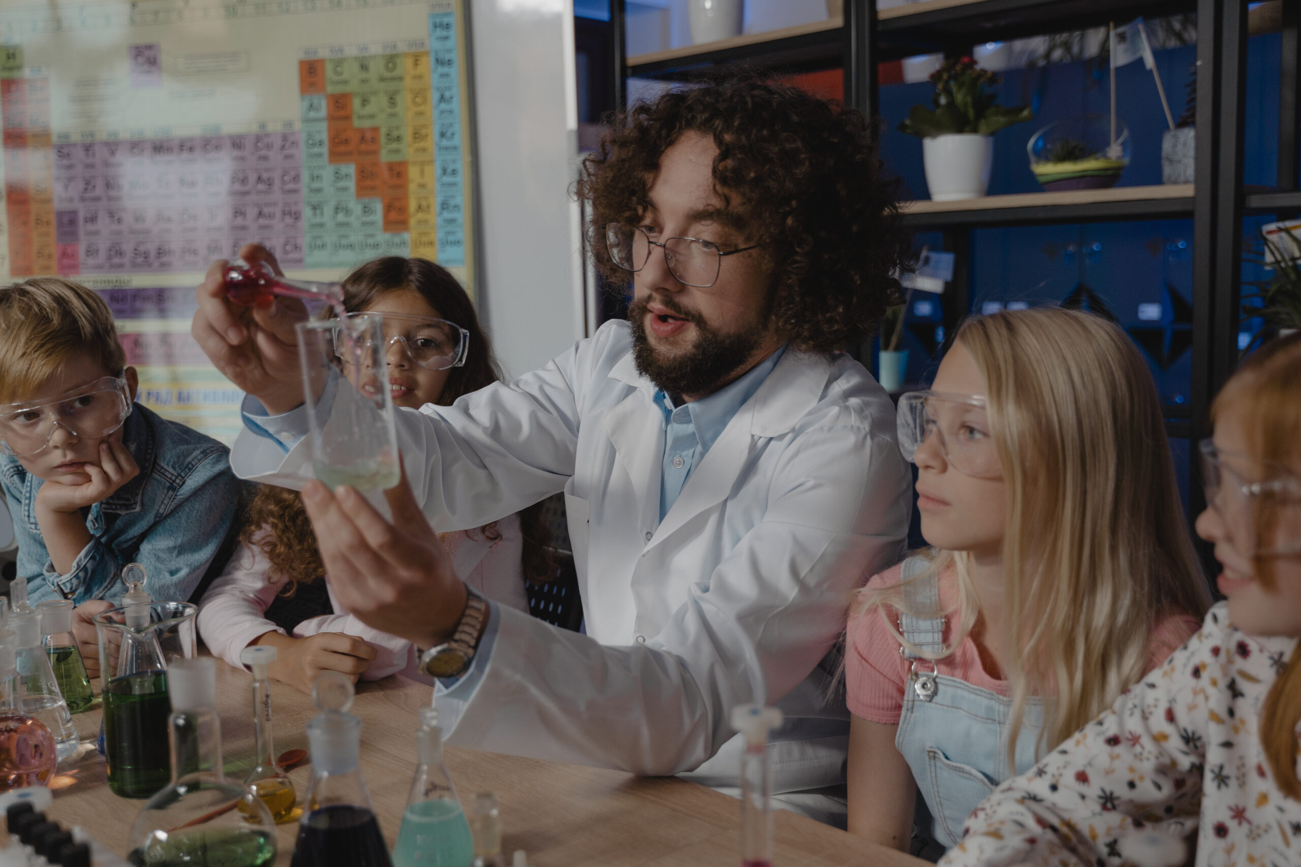 Teacher discussing chemicals in a class