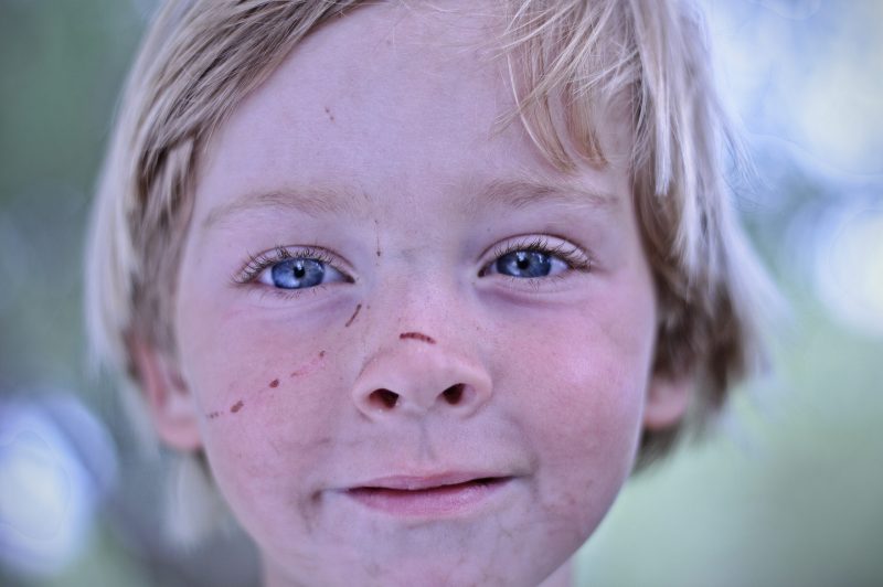 Portrait of smiling little boy in nature