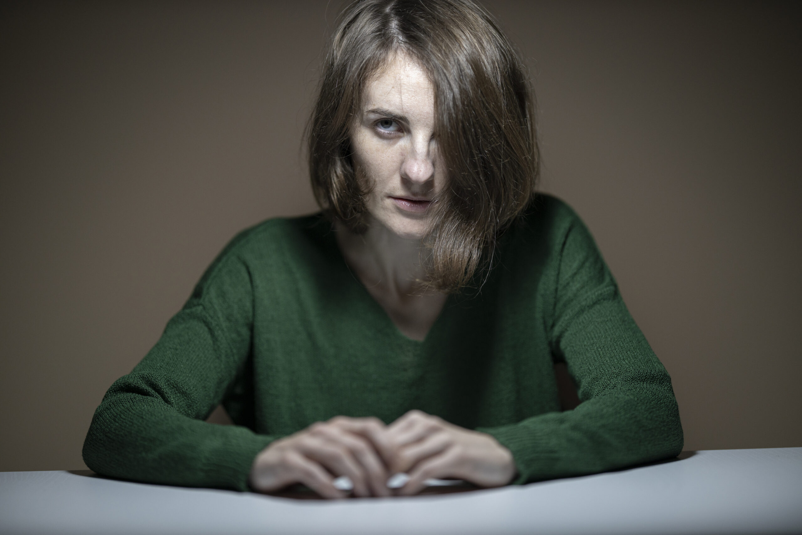 Woman wearing green sweater