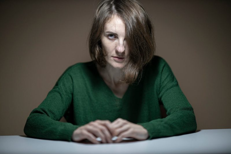 Woman wearing green sweater